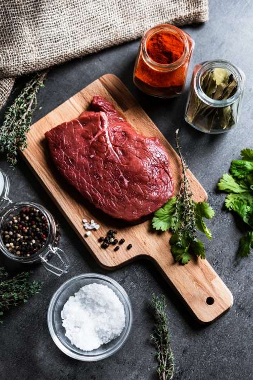 Raw lean beef meat with herbs and spices