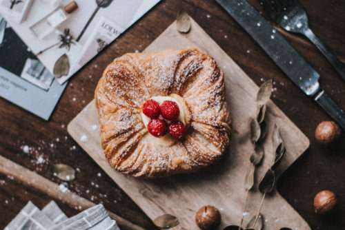 Sweet vanilla pastry with raspberries on top