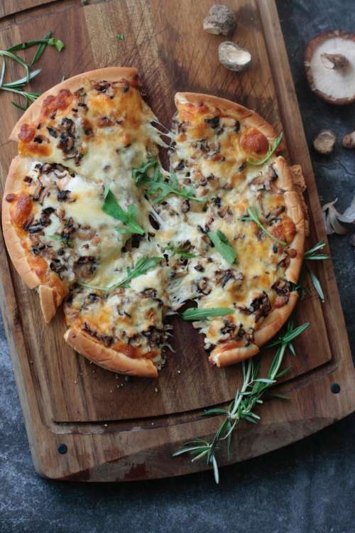 Pizza with cheese and mushrooms