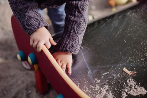 Child cleaning the slide
