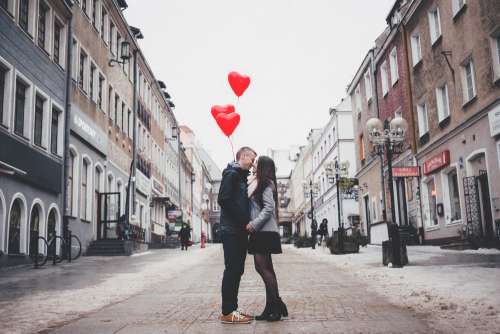 A couple with heart shape baloons 2