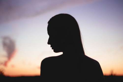 Girl’s head silhouette at sunset 2