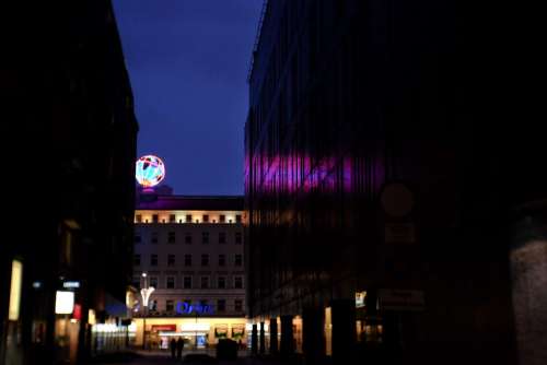 Illuminated led globe in the city at night