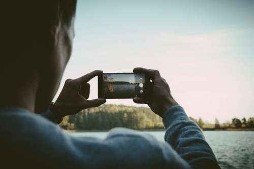 Man taking a picture with his cellphone