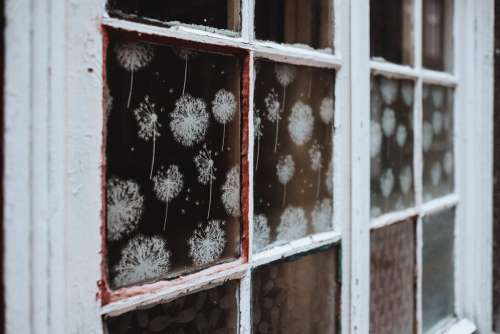 Old wooden window with spray ornaments