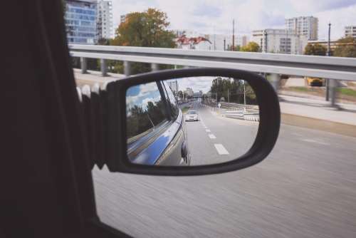 Reflection in a car side mirror