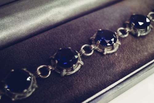 Silver bracelet with blue gems closeup