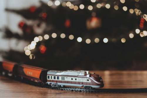 Toy train going around the Christmas tree