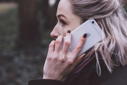 A woman talking on the phone closeup