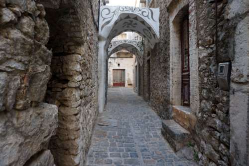 An alleyway of stone in Chois, Greece free photo