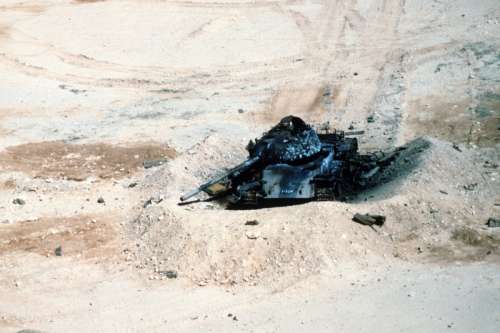 An Iraqi T-54A destroyed in the desert in the Gulf War free photo