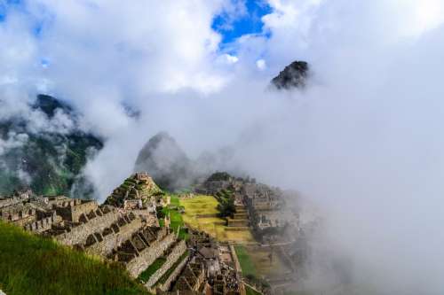 Ancient Ruins of Machu Picchu in Peru in the Clouds free photo