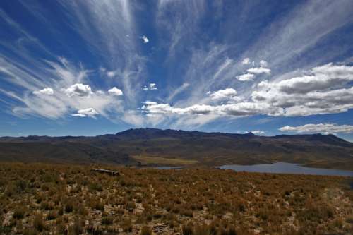 Andes landscapes with mountains, sky, and clouds in Peru free photo
