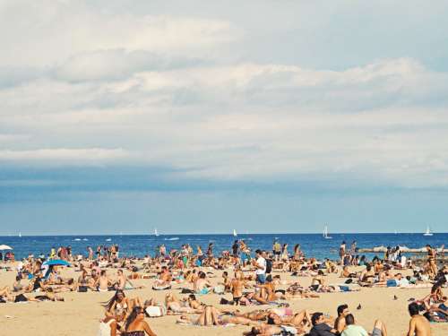 Beach in Barcelona, Spain under the clouds free photo