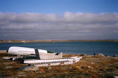 Beached komatiks at Clyde River in Nunavut, Canada free photo