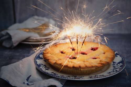 Birthday Pie with three sparklers as Candles free photo
