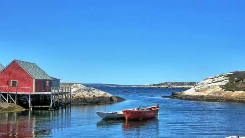 Boat and house landscape in Peggys Cove in Halifax, Canada free photo