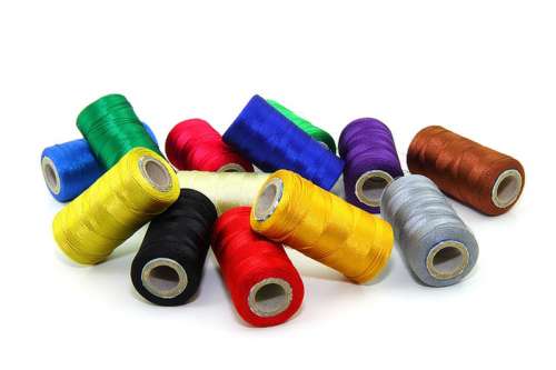 Bright Multi-colored sewing threads free photo