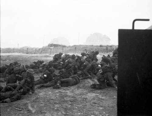 British troops take cover after landing on Sword Beach during D-Day, World War II free photo