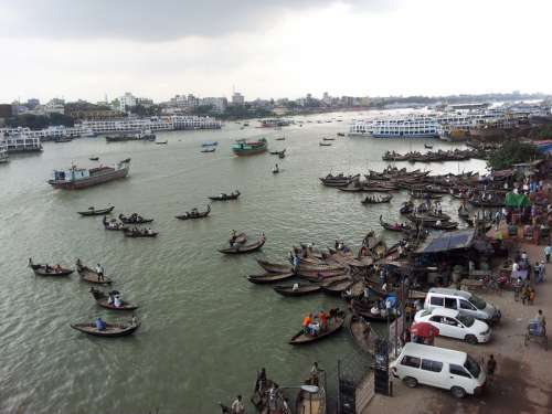 Buriganga River with lots of Boats in Dhaka, Bangladesh free photo