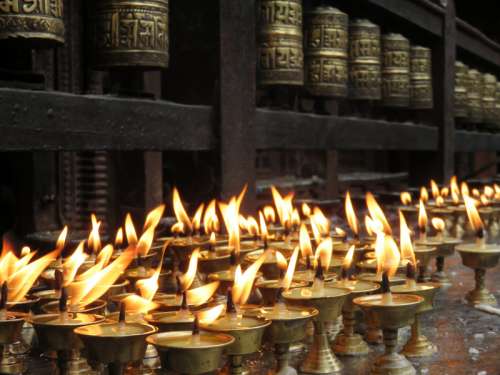 Candlelight offerings in the temple in Kathmandu, Nepal free photo