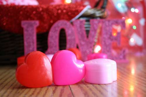 Candles and heart cases for Valentine's Day free photo