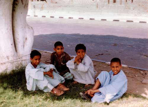 Children Sitting on the ground at Luxor, Egypt free photo