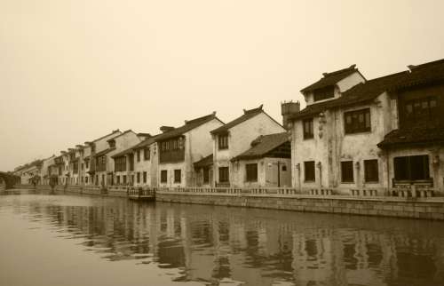 City near Qingming Bridge with houses and water in Wuxi, Jiangsu, China free photo