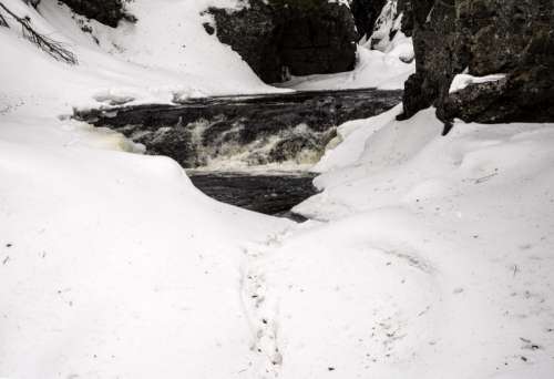 Closeup of the rapids in the snowy winter in Cascade River State Park, Minnesota free photo