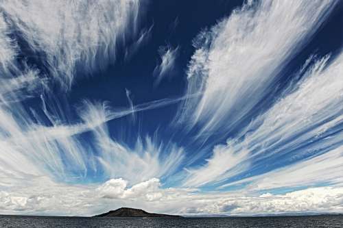Clouds and Sky with an Island in lake Titicaca in Peru free photo