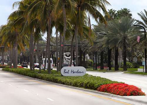 Collins Ave with trees in Bal Harbour, Florida free photo