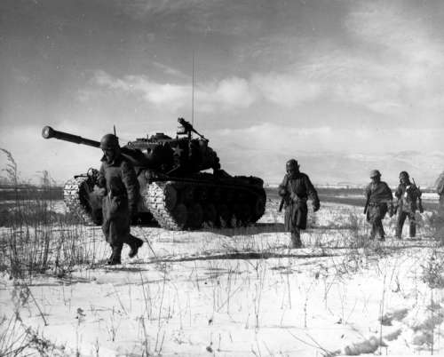 A column of the U.S. 1st Marine Division move through Chinese lines, Battle of Chosin Reservoir free photo