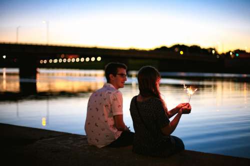 Couple sitting by the River in Dayton, Ohio free photo