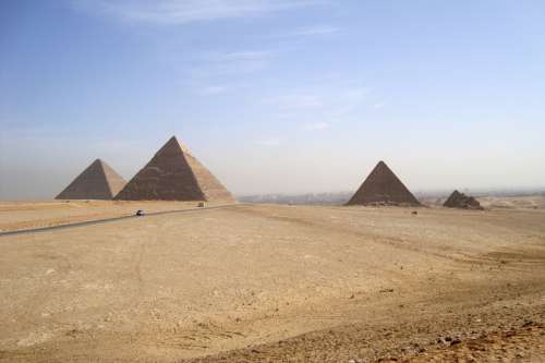 Desert landscape and Pyramids at Giza, Egypt free photo