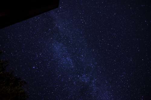 Galaxy and Stars above the Cabin and Trees at Algonquin Provincial Park, Ontario free photo