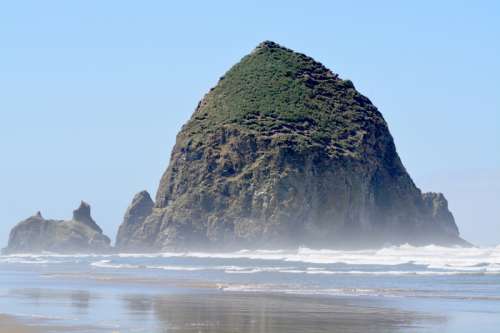 Giant Rock Coming out of the sea at Cannon Beach, Oregon free photo