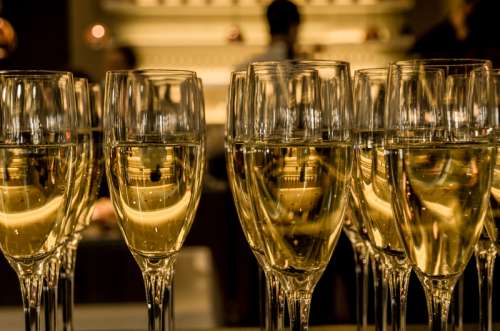 Glasses of wine celebrating the New Year free photo