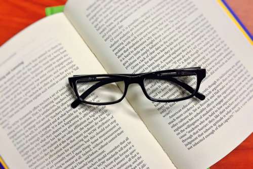 Glasses on a book  free photo