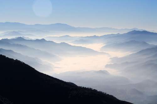 Great landscape with mountains and mist free photo