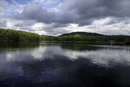 Great Skies and landscape with water reflections at Algonquin Provincial Park, Ontario free photo