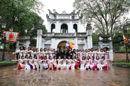 Group of people posing at the Temple of Literature in Hanoi, Vietnam free photo