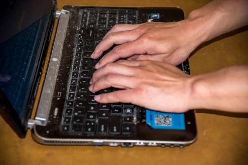 Hands Typing on Laptop free photo