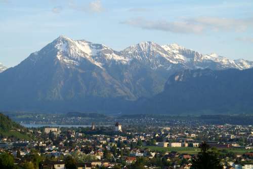 High Mountains Behind the City in Steffisburg, Switzerland free photo
