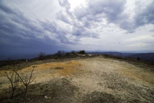 Hilltop landscape under the sky and clouds at Sassafras Mountain, South Carolina free photo