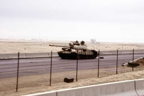 Iraqi Type 69 tank on the road into Kuwait City during the Gulf War free photo
