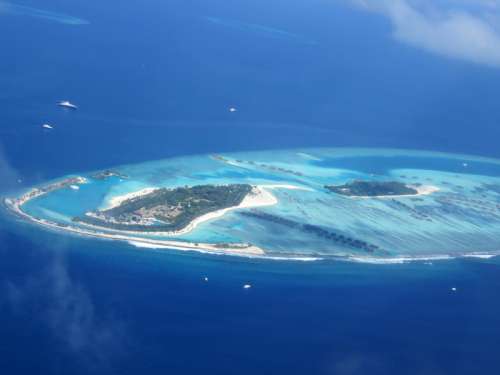 Island in the ocean in the Maldives free photo