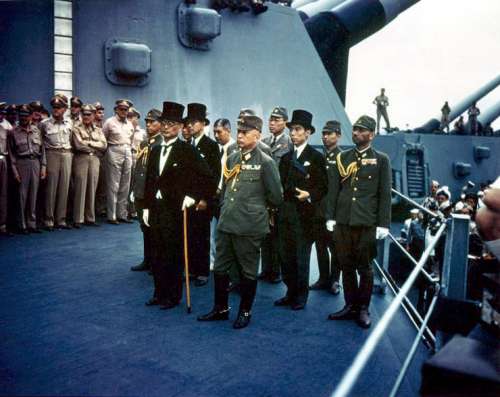 The Japanese representatives aboard the USS Missouri signing Surrender Document free photo