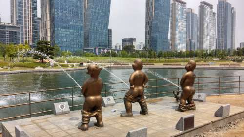 Kids Peeing into the river statue in Incheon, South Korea free photo