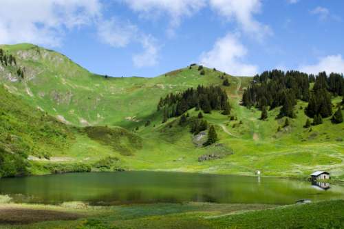 Landscape of hills at Lac des Chavonnes, Ormont-Dessous, Switzerland free photo