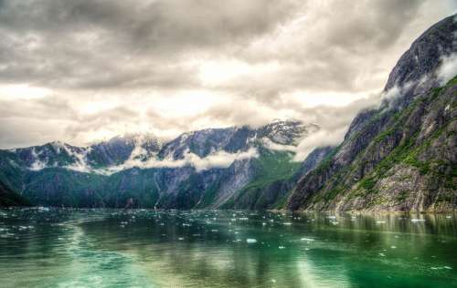 Landscape of mountains and Fjords under clouds around Juneau, Alaska free photo